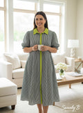 Swanky B Boutique black and white striped midi dress with lime green collar and trim, short puff sleeves, and button front.